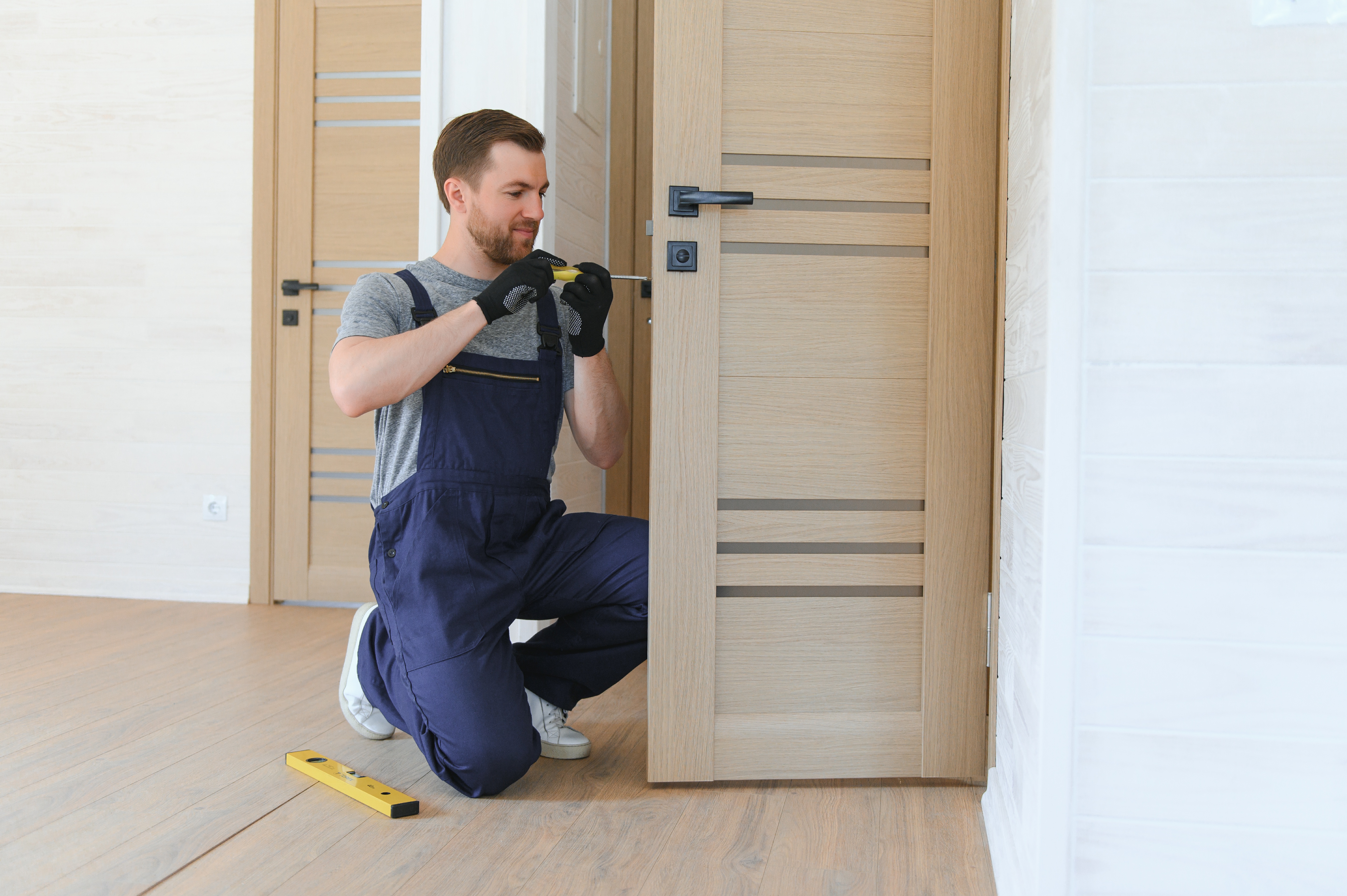 Door installation with adjustments for smooth swing